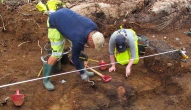 Archeologists dig at Stokke following the discovery of a Stone Age grave containing a skeleton. 