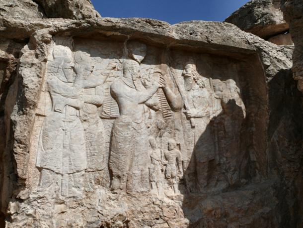 Ardashir I is receiving the Kingship's ring.