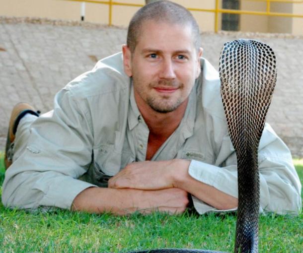 Associate Professor Bryan Fry faces off with a cobra at The University of Queensland. (The University of Queensland)