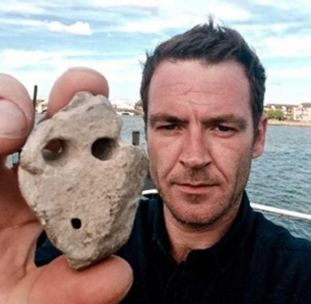 Author Ashley Cowie with the artifact recovered from Murdo's grave.