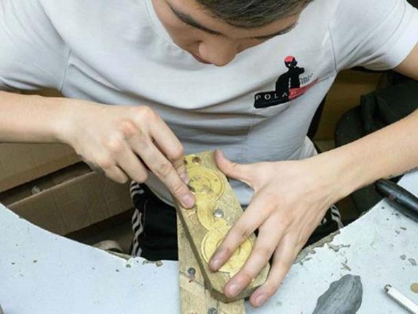 Back into fashion - a craftsman in Yakutsk makes a pair of new snow goggles. Image: The Siberian Times