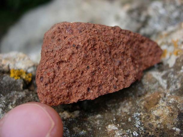 Bauxite, a major aluminum ore. The red-brown color comes from the presence of iron minerals.