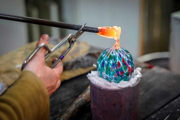A Beautiful Glass Ball Being Made by a Glass Blower. (Hypnotik Photography / Adobe Stock)