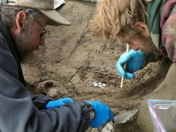 Ben Potter and colleague Joshua Reuther excavate the burial of two infants at Upward Sun River in Alaska.