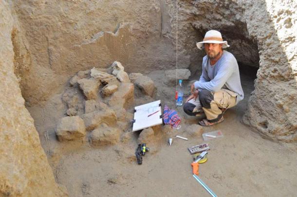M. Woźniak at work in the Berenike well, preparing drawing documentation. (J. Rądkowska / Antiquity)