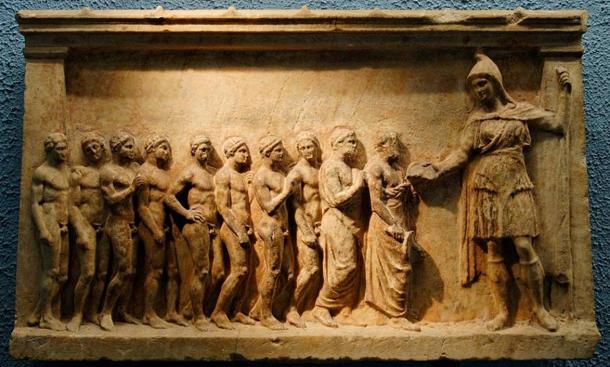 Bnedis-Artemis (on the right, wearing a Phrygian cap, a short tunic, high boots and an animal skin) and her followers, maybe athletes taking part in the torch relay race in honor of the goddess. Marble votive relief, made in Athens, ca. 400-375 BC.