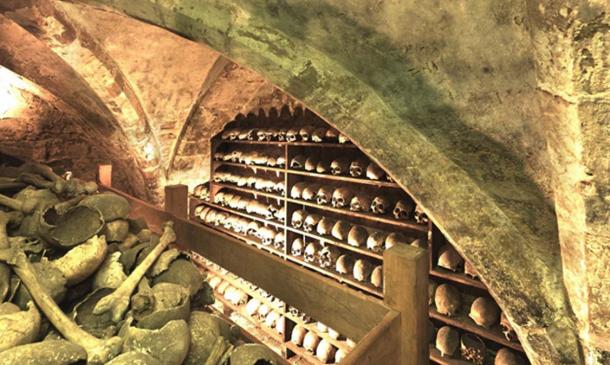 Bones line the walls and are collected in a central pile in the charnel house, Rothwell. (Image: University of Sheffield).