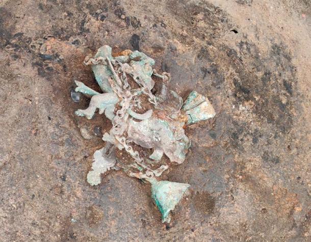 Bronze wind chime in situ. Now which protrusion is the phallus? (Ilija Danković, Archaeological Institute)