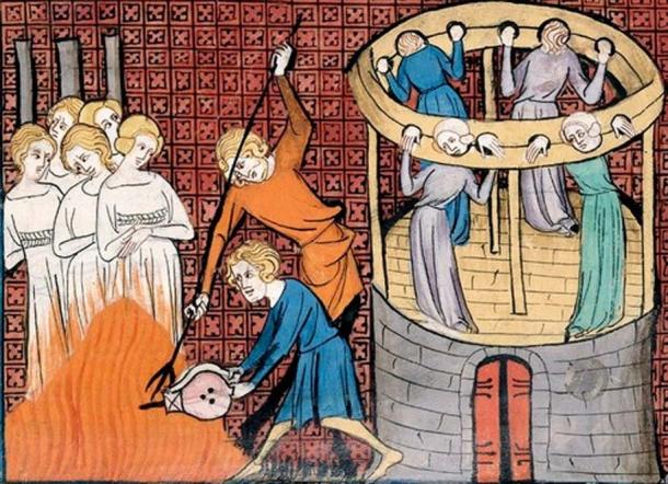 Burning witches, with others held in Stocks. (Public Domain)