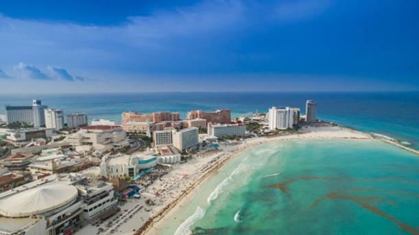 Cancun, Mexico, is a global tourist destination located miles from traditional Maya villages. Dronepicr/Wikicommons, CC BY