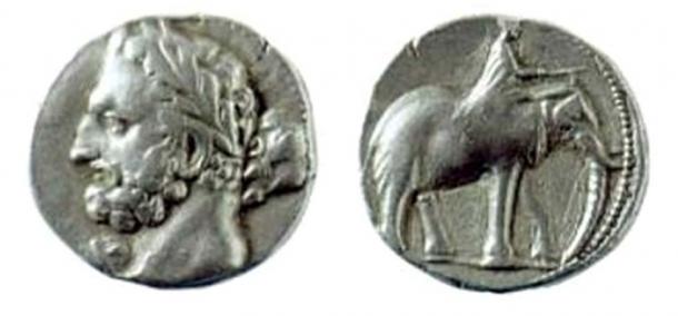A Carthaginian shekel, dated 237-227 BC, depicting the Punic god Melqart (equivalent of Hercules/Heracles), most likely with the features of Hamilcar Barca, father of Hannibal Barca; on the reverse is a man riding an elephant.