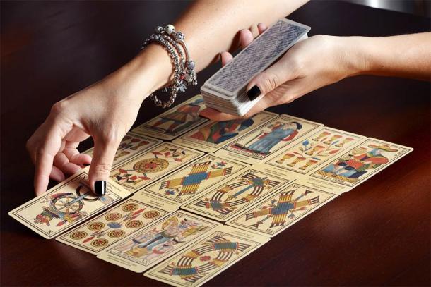 Cartomancy, the art of fortune-telling using tarot cards, has seen a resurgence. Credit: photology1971 / Adobe Stock