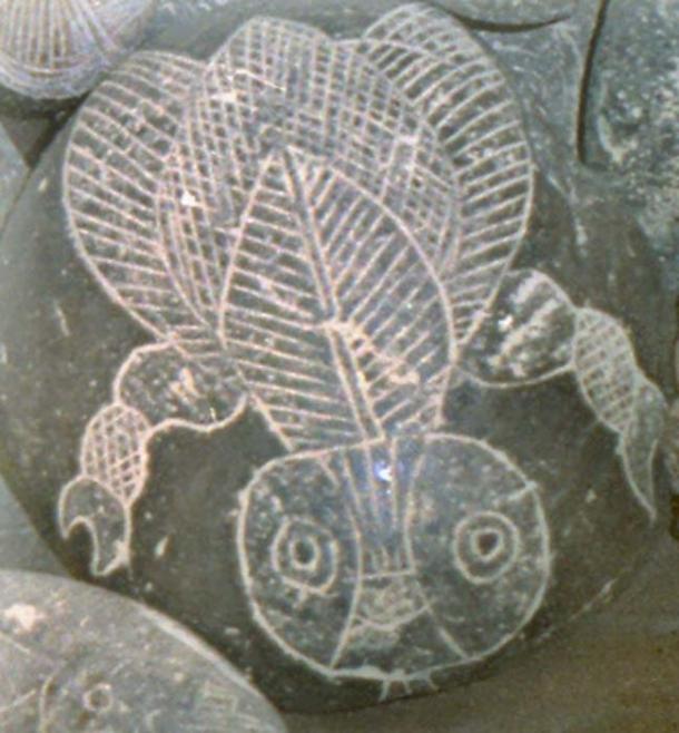 Carved stone featuring bee or insect?