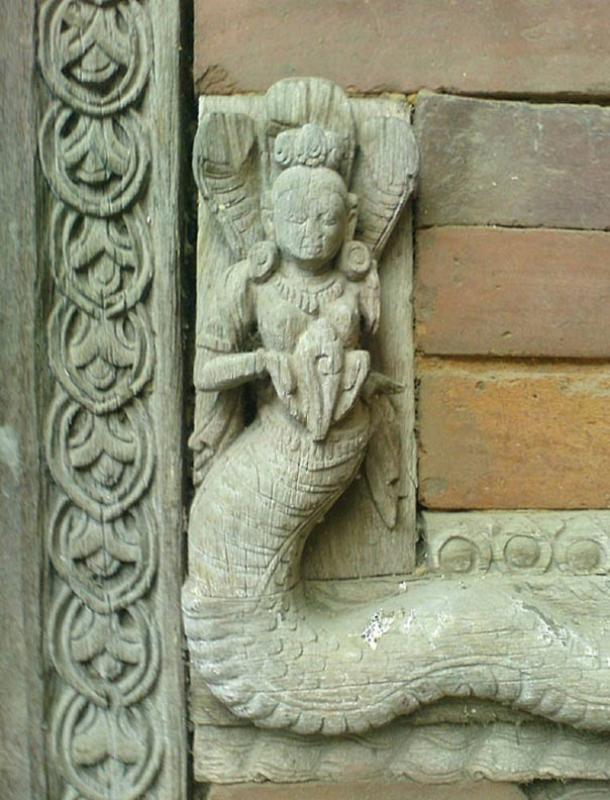 Carving of a Naga, one of many wrought from wood or stone to be found throughout Asia