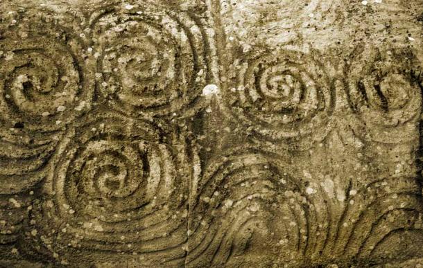 Celtic spirals at New Grange, County Meath, Ireland tell the story of Bronze Age Britain changing with the Celts from eastern France. (Tetastock / Adobe Stock)