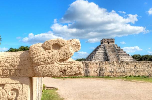 Chichen Itza Snake Head and Pyramid of Kukulcan on the edge of the Yucatan Peninsula, Mexico facing the se