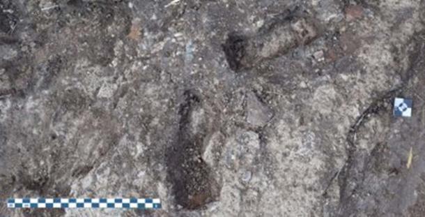Children’s footprints in the mortar pit.
