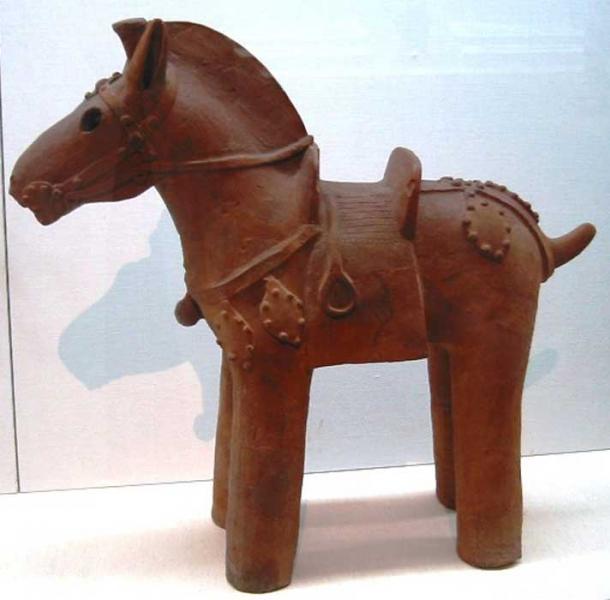 Clay horse statuette, complete with saddle and stirrups. A haniwa, from the Kofun period (6th century) in the history of Japan.