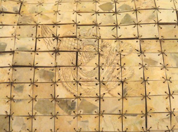 Close-up of a jade burial suit with replaced copper wire in the George Walter Vincent Smith Art Museum.