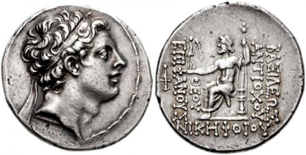 Coin depicting Antiochus IV, ruler of the Seleucid Empire, Greek inscription reads ΘΕΟΥ ΕΠΙΦΑΝΟΥΣ ΝΙΚΗΦΟΡΟΥ / ΒΑΣΙΛΕΩΣ ΑΝΤΙΟΧΟΥ which translates to “King Antiochus, image of God, bearer of victory”. (Ingsoc / CC BY-SA 3.0)
