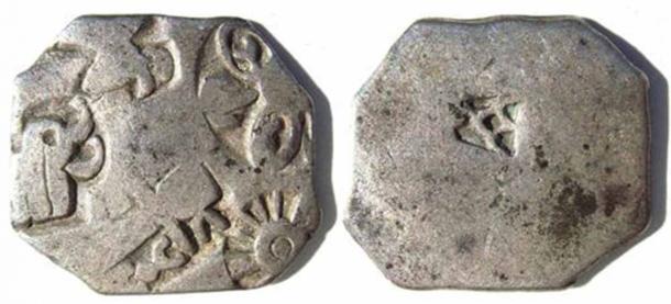 Coin of the Mauryan Empire, with wheel and elephant symbols. (Public Domain)
