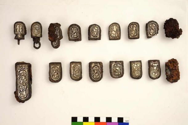 Collegno, tomb 143. Iron ‘multiple’ belt elements with silver and brass inlay. (Stonybrook News)