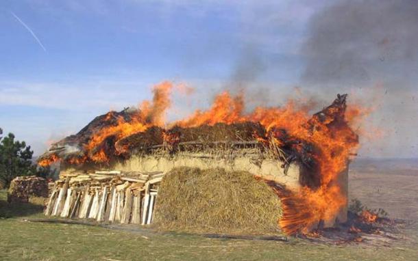 Controlled recreation of the burning of a Cucuteni-Trypillian house, which would have required a great deal of fuel to coincide with the burnt remains left behind. (Public domain)