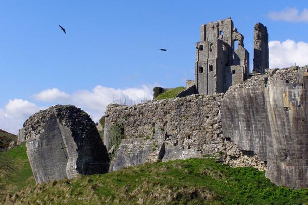 Corfe Castle; within whose dungeon Maud de Braose and her son William were starved to death.