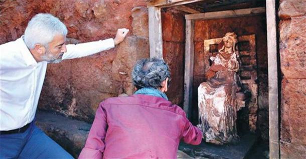 Examining the Cybele statue in Ordu, Turkey.