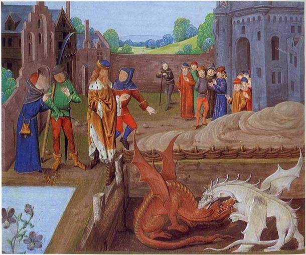 Detail from Lambeth Palace Library MS 6 folio 43v illustrating an episode in Historia Regum Britanniae (c. 1136). Pictured above Vortigern stands at the edge of a pool whence two dragons emerge, one red and one white, which do battle in his presence. (Public Domain)
