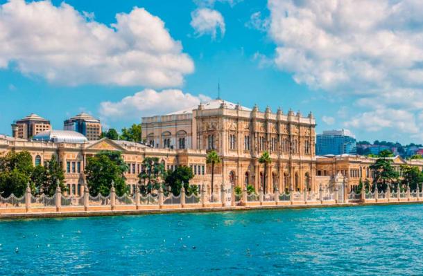 Dolmabahce Palace is a historic palace located on the European shore of the Bosphorus strait in Istanbul, Turkey. It was built in the mid-19th century by the Ottoman sultan Abdulmecid I as a symbol of the declining Ottoman Empire's power and wealth. The palace is known for its opulent design, with influences from European neoclassical, Baroque, and Rococo styles, and is now a popular museum and tourist attraction in Istanbul. Source: Joshua Davenport / Adobe Stock