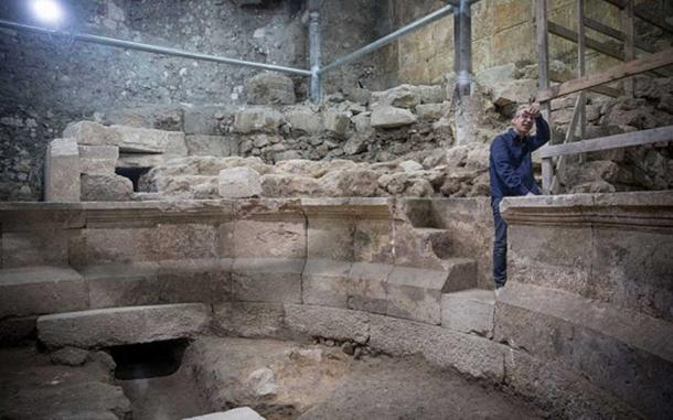 Dr. Joe Uziel, Excavation Director, standing on steps of the amphitheater (Image: Israel Antiquities)