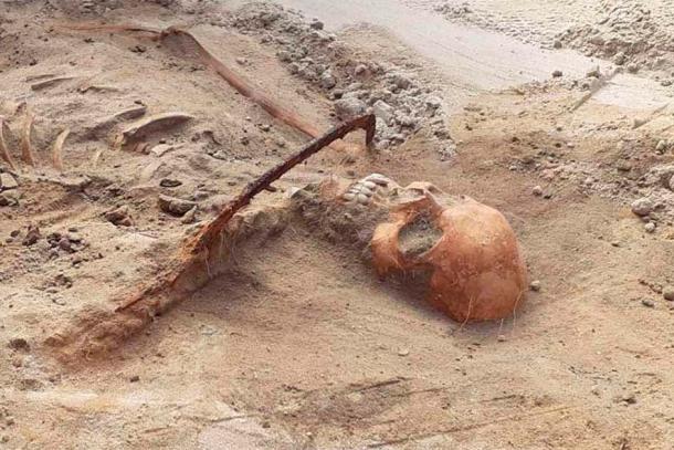 Dubbed the Vampire of Pień, a vampire grave discovered in 2022 included the remains of a female vampire pinned to the ground with a sickle across her throat. (Mirosław Blicharski / Aleksander Poznań)