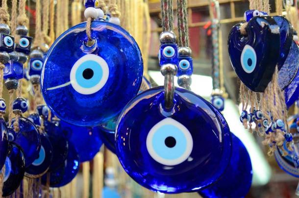 Due to one ancient superstition, the blue and white “eye” is commonly used in both Greece and Egypt to ward off the effects of the evil eye. (ShU studio / Adobe Stock)