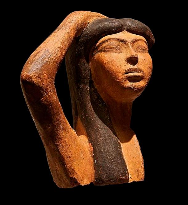 A rare sample of Egyptian terra cotta sculpture depicts Isis mourning Osiris. The sculpture portrays a woman raising her right arm over her head, a typical gesture of mourning.
