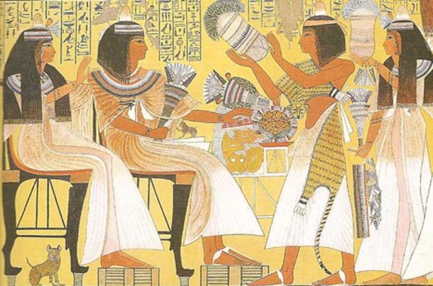 Egyptians wearing perfume cone. The cones would melt and cause fragrance to soak their wigs. painting from Tomb at Thebes dates to about 1275 BC. (CC BY 2.0)