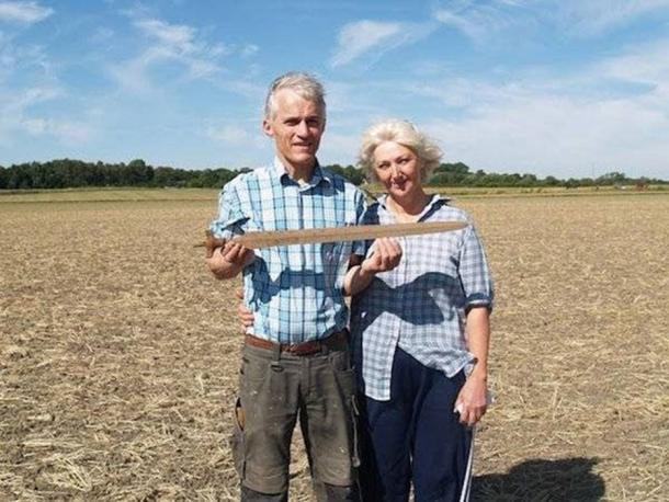 Ernst Christiansen and Lis Therkelsen with the 3,000-year-old sword they discovered. (Courtesy of Museum Vestsjælland)