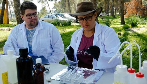 Evidence-based findings: Dr Sophia Aharonovich carries out a soil sample test at the Ziklag field site alongside student Edward Clancy. (Macquarie University)