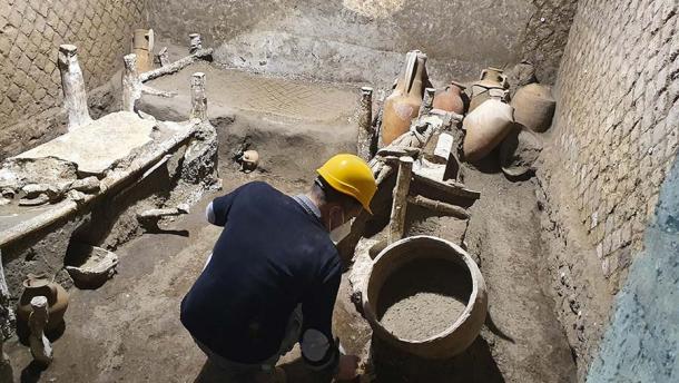 Examining the slave room at Villa Civita Giuliana, a wealthy suburb of Pompeii. (Pompeii Archaeological Park)