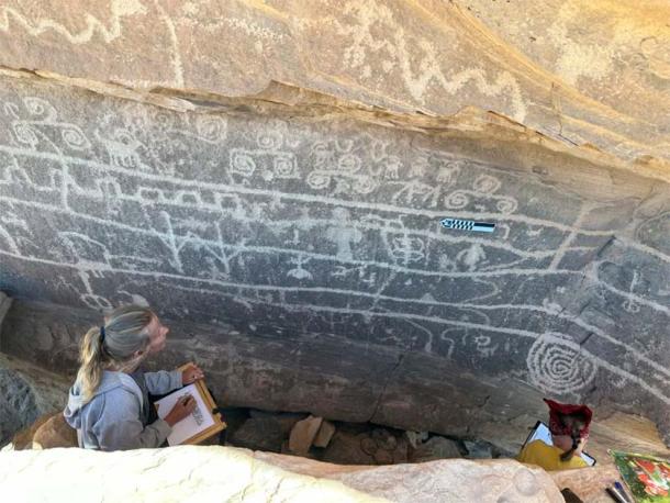 Examining some of the pueblo culture petroglyphs. (Jangiellonian University)