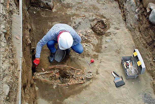 Excavating the remains of one of the sacrificed children.