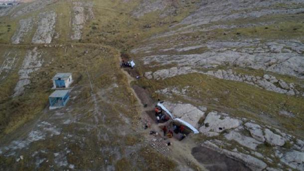 The excavation site where the Assyrian relief carvings were found, cut into the bedrock above an ancient irrigation canal in the Faida district of Iraq's Kurdistan region. (Alberto Savioli / Land of Nineveh Archaeological Project / University of Udine)