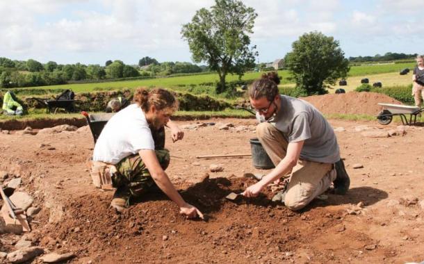 Excavations underway at the burial mound next to Bryn Celli Ddu, researchers Danny Lee and Cameron Black