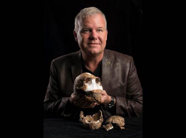 Famous human evolution scientist Lee Berger holds the skull of Homo naledi, which was found in 2015 in the Cradle of Humankind area of South Africa. (Wits University)