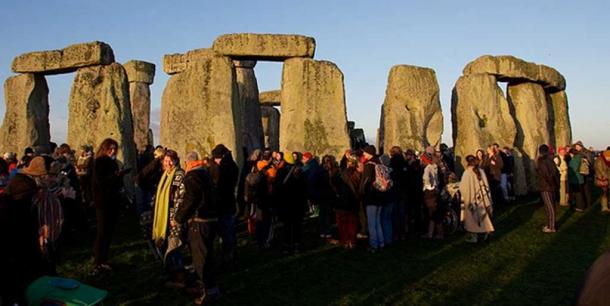 Festive people at Stonehenge, England for the Pagan Winter Solstice Celebration 