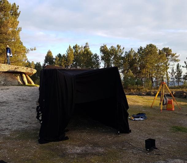 Fieldwork at one of the passage graves in Portugal, Dolmen da Orca. Next to the stone structure is a replica tent to simulate the view from inside of the passage grave. Daniel Brown