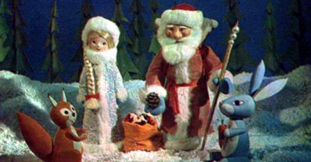 Figures of Father Frost and Snow Maiden providing gifts to their animal friends in an animated holiday show.