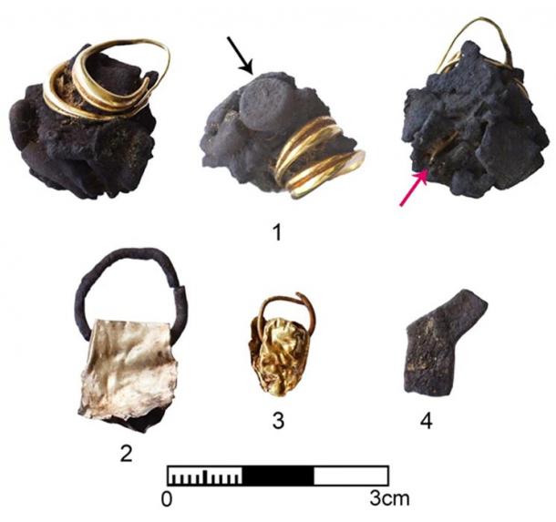 Gold and silver jewelry from a home. The arrows point to a silver amulet and another gold object inside the molten silver 