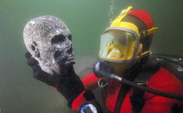 Granite head of a priest discovered in the submerged ruins of Thonis-Heracleion, Alexandria, Egypt (Cristoph Gerigk)