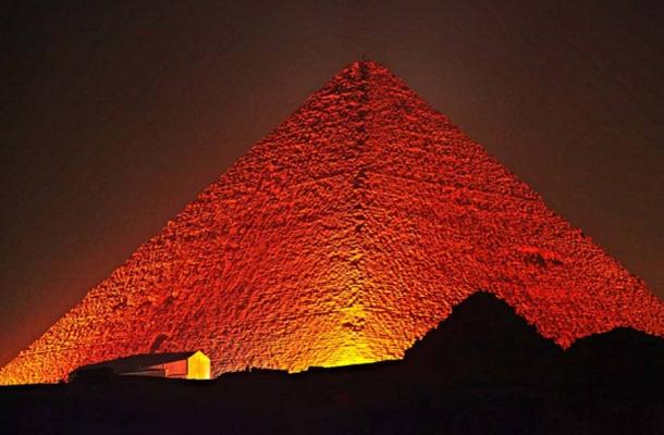 Evidence of their seemingly impossible technological manifestations—the Great Pyramid being among the most widely recognized, with many others gaining attention—lies in ruins around the Earth, the implications largely ignored by experts who can't adequately explain them within academically accepted contemporary models. Great Pyramid of Giza at night.